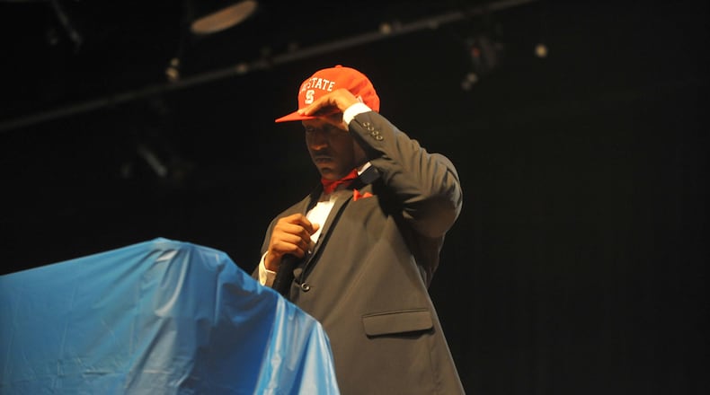 FEBRUARY 5, 2014 STONE MOUNTAIN Stephenson player Tyler Jones announces he will be attending North Carolina State. High school football signing day activities at Stephenson High School in Stone Mountain, Wednesday, February 5, 2014. Twenty-one players signed letters of intent for colleges across the country.  KENT D JOHNSON/KDJOHNSON@AJC.COM