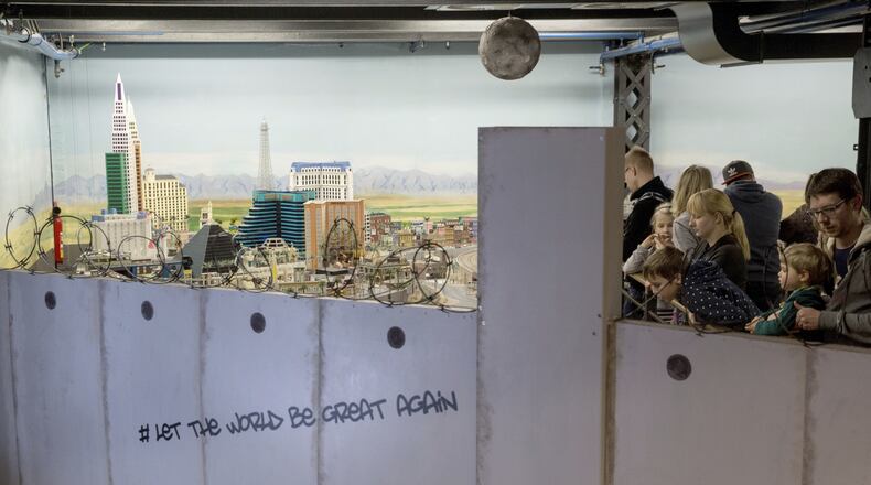 In this Jan. 31, 2017 photo visitors to the miniature wonderland in Hamburg , Germany, can only look at a model landscape of the United States from behind a wall . (Christian Charisius/dpa via AP)