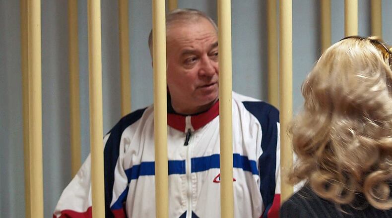 A photo dated Aug. 9, 2006 shows Sergei Skripal talking from a defendants cage to his lawyer during a hearing at the Moscow District Military Court in Moscow, Russia