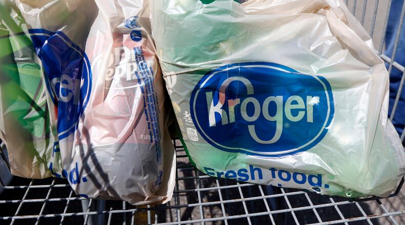 In this June 15, 2017 file photo, bagged purchases from the Kroger grocery store in Flowood, Miss., sit inside a shopping cart. (AP Photo/Rogelio V. Solis, File)