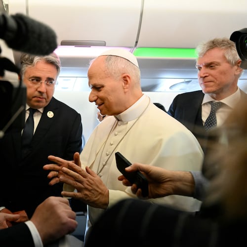 Pope Leo XIV speaks to journalists aboard his flight bound for Algiers’ Houari Boumédiène International Airport on Monday, April 13, 2026, at the start of an 11-day apostolic journey to Africa. (Alberto Pizzoli/Pool Photo via AP)