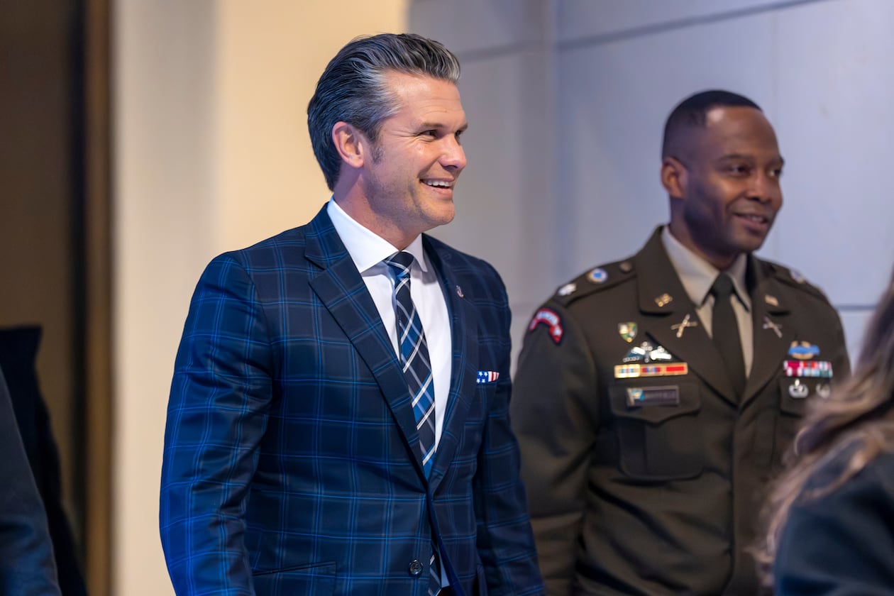 Defense Secretary Pete Hegseth smiles as he walks to a secure room in the basement of the Capitol to brief lawmakers on how he handled a military strike on a suspected drug smuggling boat and its crew in the Caribbean near Venezuela Sept. 2, at the Capitol in Washington, Tuesday, Dec. 9, 2025. (AP Photo/J. Scott Applewhite)
