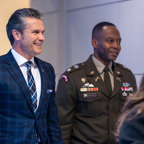 Defense Secretary Pete Hegseth smiles as he walks to a secure room in the basement of the Capitol to brief lawmakers on how he handled a military strike on a suspected drug smuggling boat and its crew in the Caribbean near Venezuela Sept. 2, at the Capitol in Washington, Tuesday, Dec. 9, 2025. (AP Photo/J. Scott Applewhite)