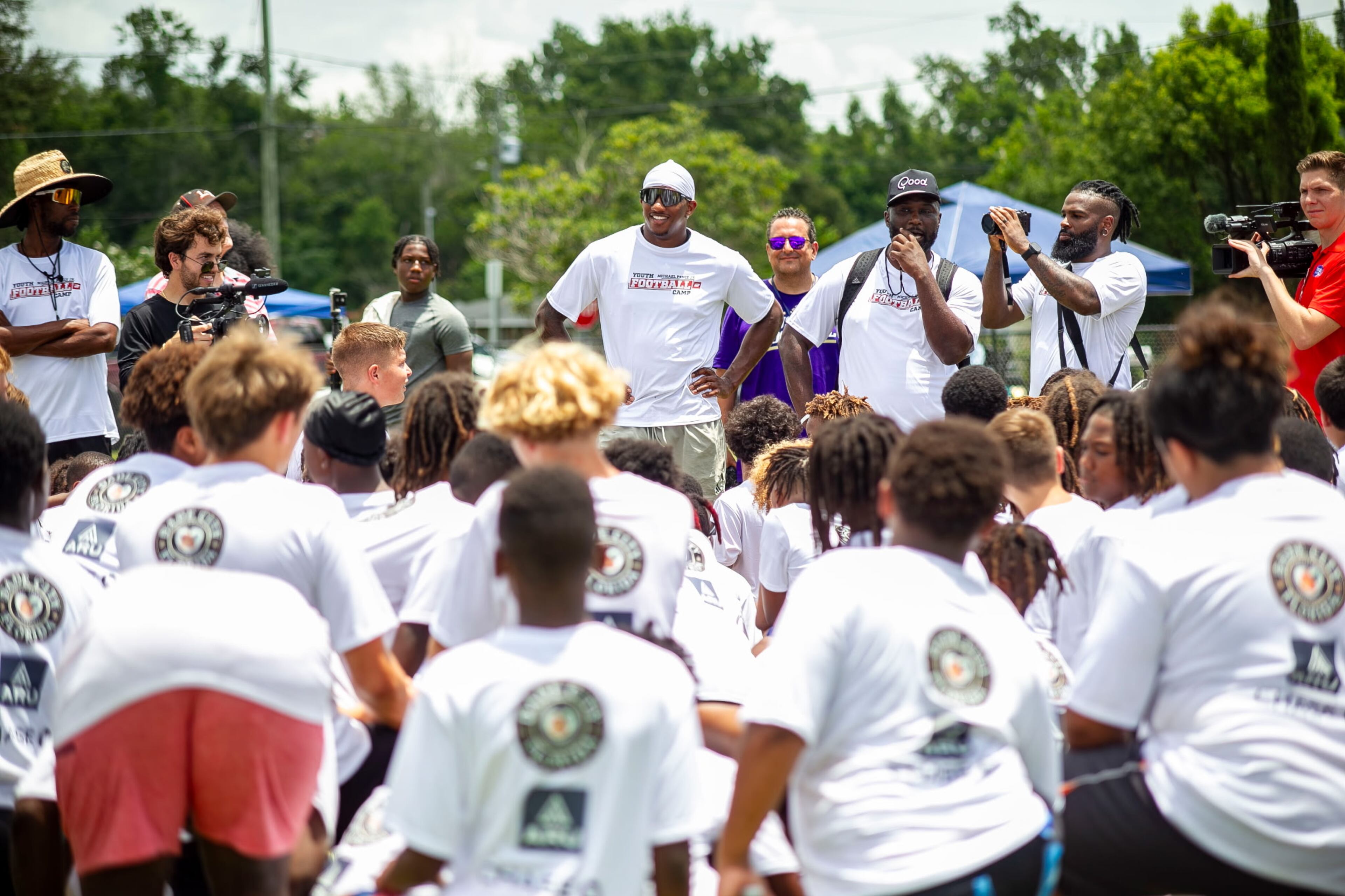 Falcons quarterback Michael Penix Jr. (center, white cap) speaks to campers at his youth camp Sunday, June 29, 2025 in Dade City, Florida. (Photo by Hanna Fox Maglio)