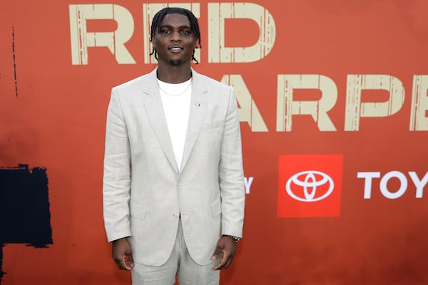 Miami quarterback Cameron Ward poses on the carpet before first round of the NFL football draft, Thursday, April 24, 2025, in Green Bay, Wis. (AP Photo/Matt Ludtke)