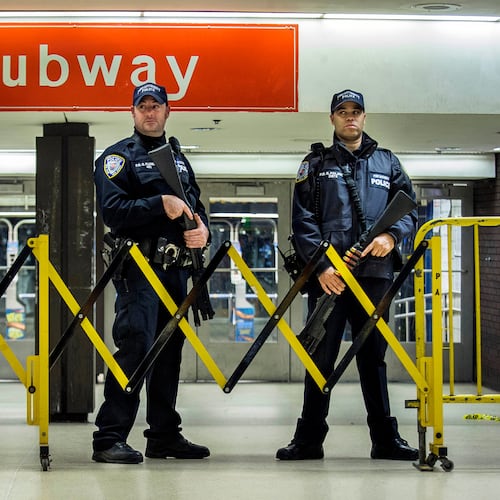 FILE - Police stand guard inside the Port Authority Bus Terminal following an explosion near Times Square, Dec. 11, 2017 in New York. (AP Photo/Andres Kudacki, File)