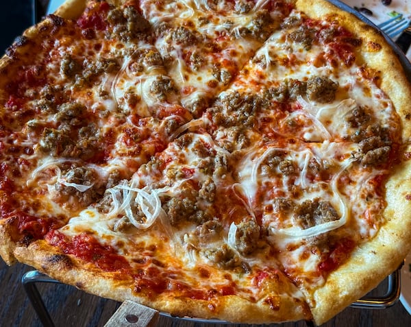 The K.R.O.G. pizza at Krog Bar, made with fennel sausage, onions and mozzarella. (Henri Hollis/AJC)