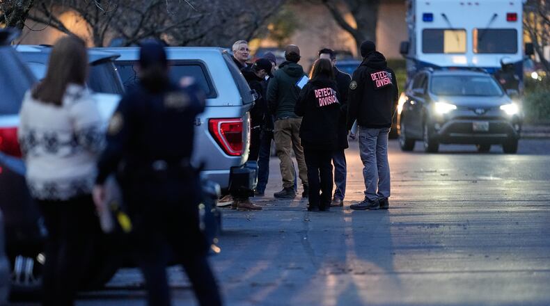 Law enforcement officials work the scene following reports that federal immigration officers shot and wounded people in Portland, Ore., Thursday, Jan. 8, 2026. (AP Photo/Jenny Kane)
