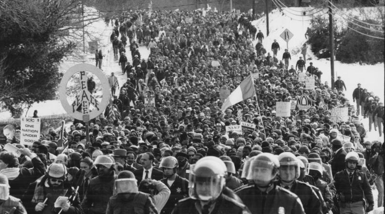 870117 - Brotherhood march in Forsyth County, GA is flanked by law enforcement personnel on January 17, 1987. (RICH ADDICKS/AJC staff)