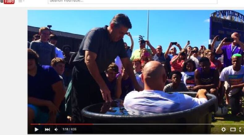The “mass baptism” reportedly involved at least one coach and multiple Villa Rica High School football players. (Credit: 11Alive via YouTube)