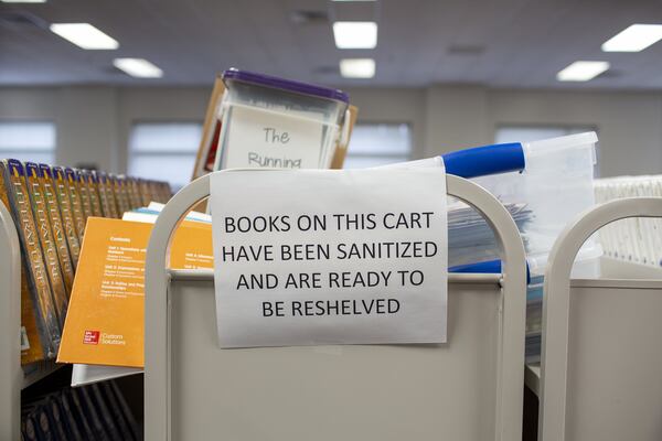 Sanitized books wait to be reshelved in Northbrook Middle School in Suwanee, Georgia, on Wednesday, July 8, 2020. Gwinnett County Schools, the state’s largest school system, pushed back its opening date from Aug. to Aug. 12 to give the district more time to review its reopening plans. 