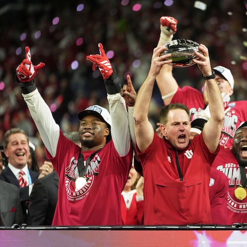 Indiana head coach Curt Cignetti holds up the championship trophy after the Big Ten championship NCAA college football game against Ohio State in Indianapolis, Saturday, Dec. 6, 2025. (AP Photo/Michael Conroy)