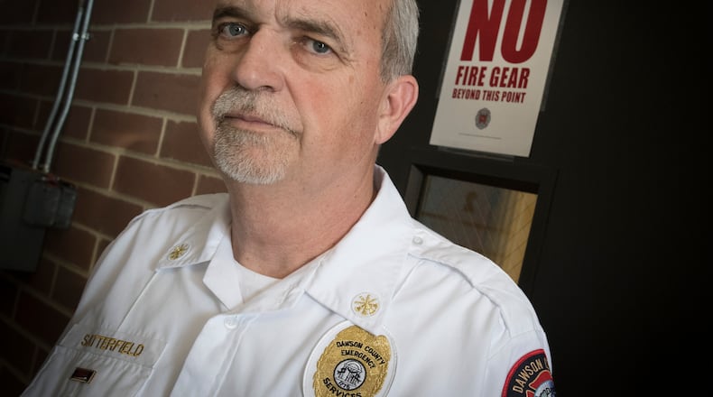 Dawson County Emergency Services Deputy Chief Operations Tim Satterfield is pictured at a fire station in Dawsonville, Ga. Satterfield, who is dealing with a pancreatic cancer diagnosis has had to pay many treatment bills himself and supports the Firefighter Insurance Bill (HB 146) which would require local governments to provide insurance to firefighters including coverage for a list of cancers. John Amis/AJC
