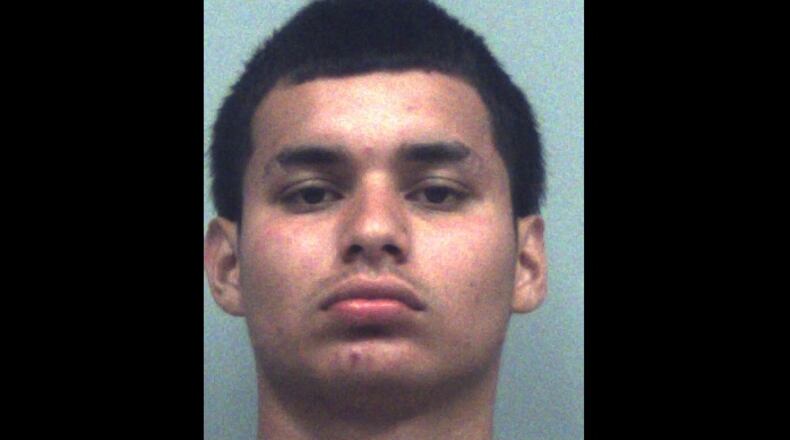 Yan Mario Hernandez-Castillo has been charged with 10 counts of aggravated assault, participation in gang activity, shooting a gun near the street, reckless conduct and marijuana possession.