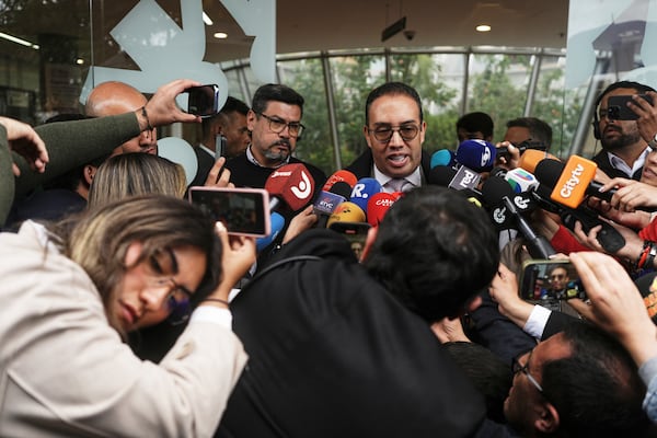 Lawyer Victor Mosquera, representative of Senator Miguel Uribe Turbay, talks outside the clinic where the Colombian Senator is being treated after he was shot at a political rally in Bogota, Colombia, Monday, June 9, 2025. (AP Photo/Ivan Valencia)