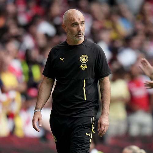 Manchester City's head coach Enzo Maresca, left, and Arsenal's manager Mikel Arteta react during the FA Community Shield final soccer match between Arsenal and Manchester City in Cardiff, Wales, Sunday, Aug.16, 2026. (AP Photo/Alastair Grant)