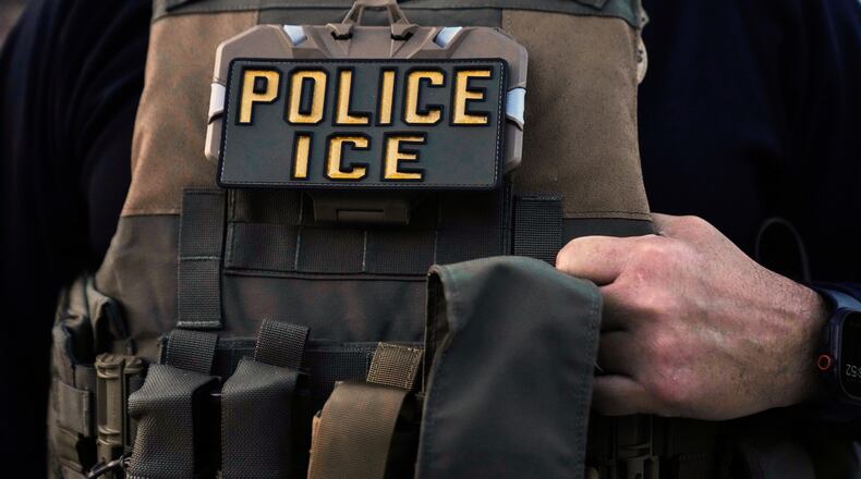 FILE - A U.S. Immigration and Customs Enforcement agent is seen in Park Ridge, Ill., Sept. 19, 2025. (AP Photo/Erin Hooley, File)