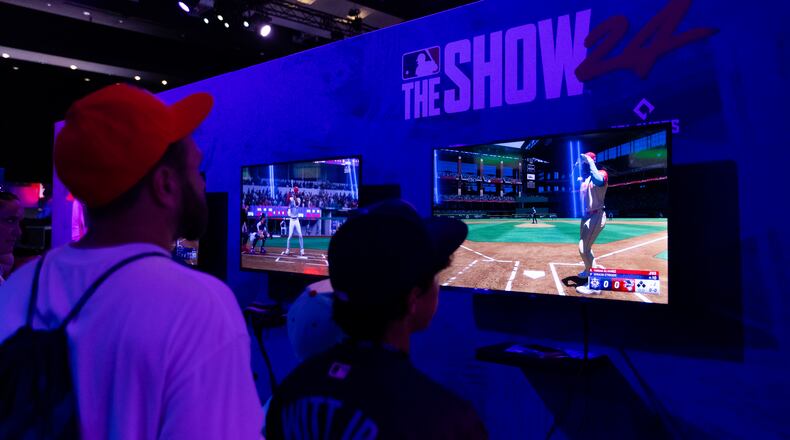 Fans play MLB: The Show during the 2024 Capital One All-Star Village  at Globe Life Field on Saturday, July 13, 2024 in Arlington, Texas. (Photo by Ray Bahner/MLB Photos via Getty Images)