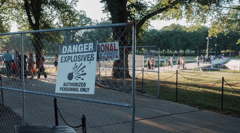Fencing that will secure an area around where fireworks for the Fourth of July will be launched is seen near the Lincoln Memorial Reflecting Pool and the World War II Memorial Tuesday, June 23, 2026, in Washington. (AP Photo/Jon Elswick)