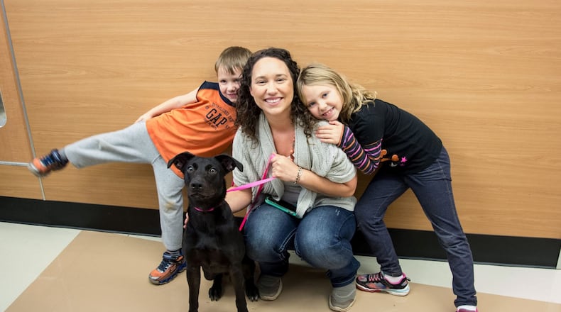 A family adopts a new pet at last year's Black Friday adoption special.