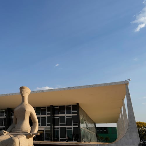 FILE - The Statue of Justice stands in front of the Supreme Court during the verdict and sentencing phase of a trial for those charged in an alleged coup plot to keep Brazil's former President Jair Bolsonaro in office after his 2022 election defeat, in Brasilia, Brazil, Sept. 11, 2025. (AP Photo/Eraldo Peres, File)