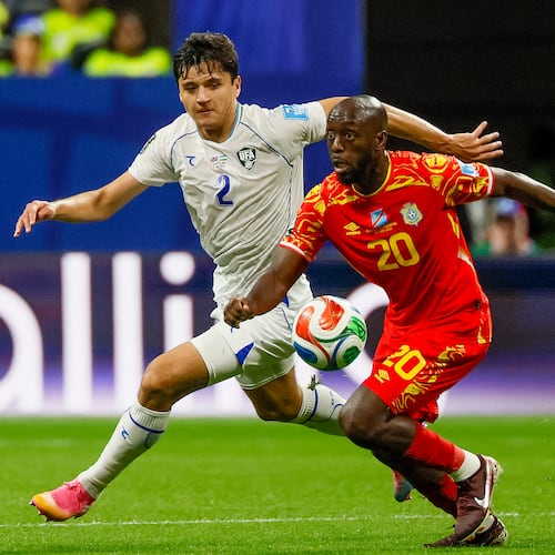 Uzbekistan defender Abdukodir Khusanov (left) chases Congo forward Yoane Wissa (right) across midfield during the first half of a FIFA World Cup match at Atlanta Stadium (Mercedes-Benz Stadium) on Saturday, June 27, 2026, in Atlanta. (Miguel Martinez/AJC)