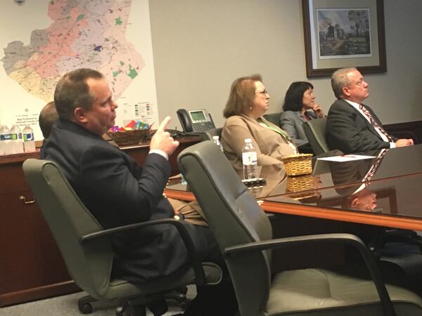 Gwinnett County Commissioner Tommy Hunter asks a question during a Tuesday morning briefing from the county's water resources department.