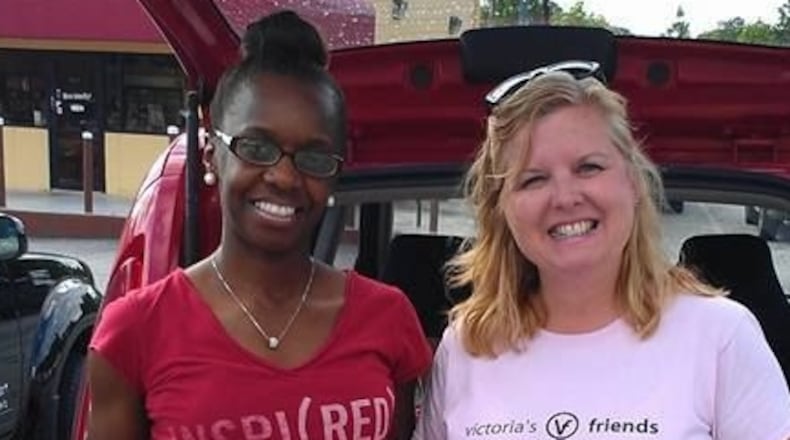 Keisha Cook (L) and Jennifer Damron (R) are two of Victoria's Friends 15 Outreach Leaders shown with gift bags that contain items such as journals, jewelry, makeup, candles, etc. A hotline card with their number is included in the bag. They have gone as far south as Macon and as far north to Rome.