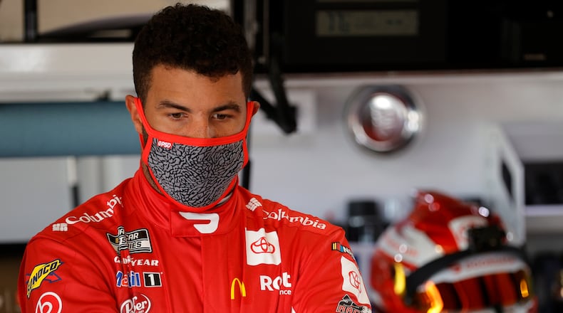 Bubba Wallace, the driver of the #23 DoorDash Toyota, waits in the garage area during practice for the NASCAR Cup Series 63rd Annual Daytona 500 at Daytona International Speedway on February 10, 2021, in Daytona Beach, Florida. (Chris Graythen/Getty Images/TNS)