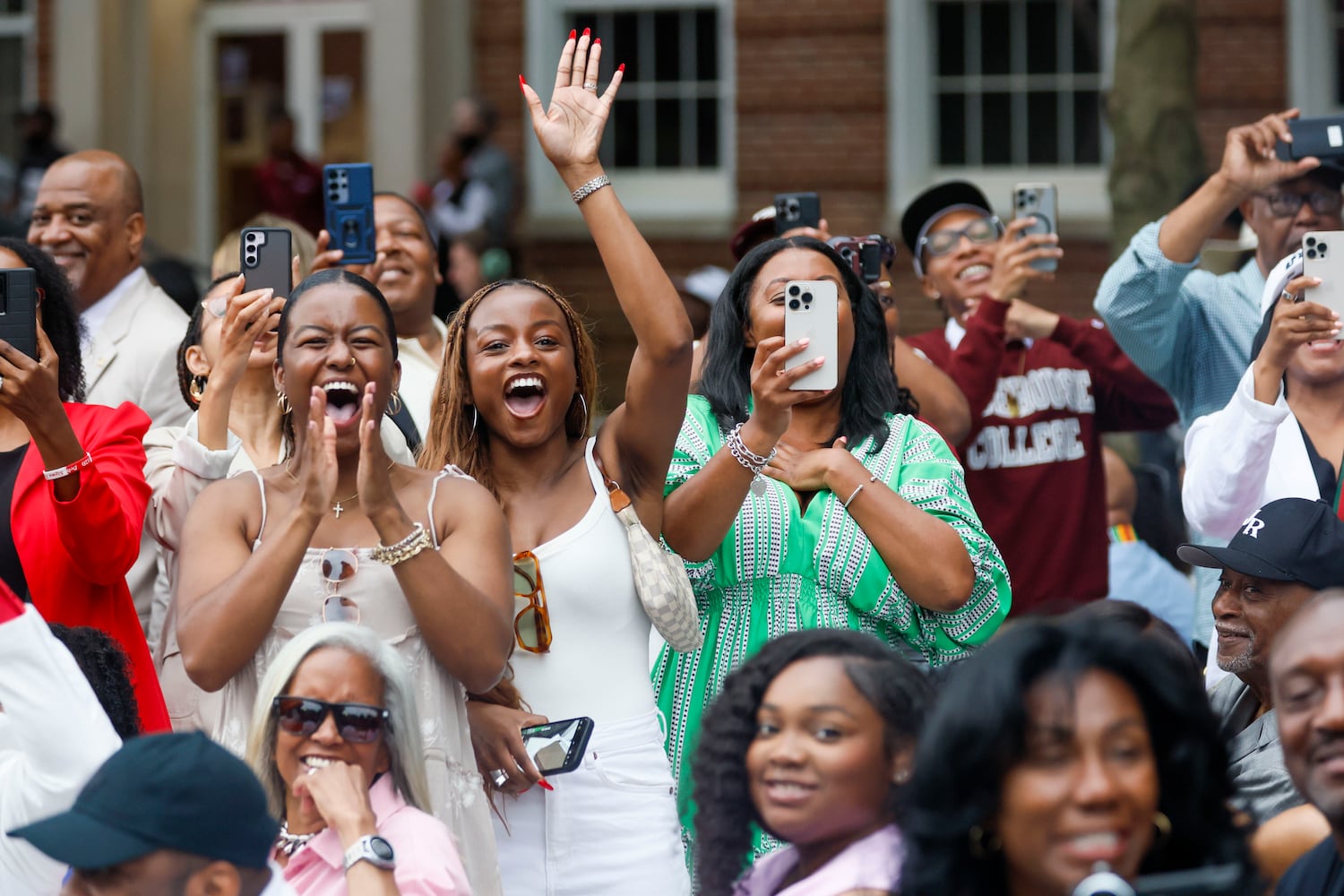 Family members cheer for their graduate during the 141st Commencement Ceremony of Morehouse College on Sunday, May 18, 2025.(Miguel Martinez/ AJC)