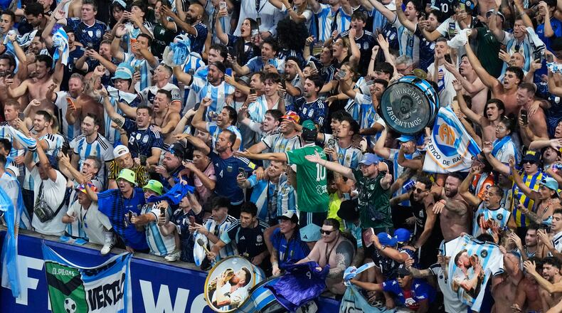 Fans of Argentina celebrate after they defeated England in their World Cup semifinal soccer match in Atlanta, Wednesday, July 15, 2026. (AP Photo/Lynne Sladky)