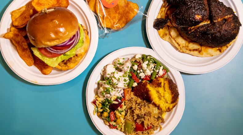 Nani’s Piri Piri Chicken at Ponce City Market offers menu options including Nani's Chicken Burger, Half Chicken, and sides with Piri Piri House Chips.  (Mia Yakel for The Atlanta Journal-Constitution)