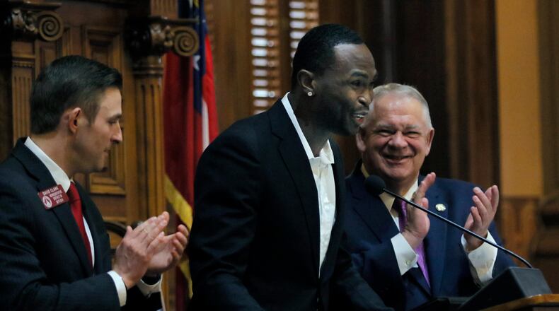 Falcons star Julio Jones, standing with speaker David Ralston and Rep. David Clark, R-Buford, visited the Georgai General Assembly on Wednesday.  BOB ANDRES  /BANDRES@AJC.COM