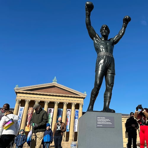 FILE - Visitors gather around the Rocky Statue during RockyFest 2024 at the Philadelphia Museum of Art, Dec. 3, 2024, in Philadelphia. (AP Photo/Tassanee Vejpongsa, File)