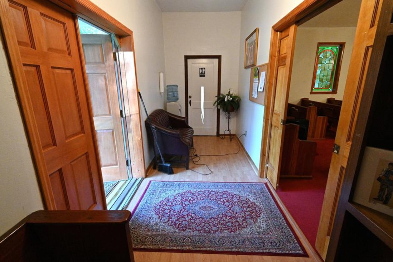 Harold and Thelma Swain were shot in the vestibule of Rising Daughter Baptist Church in 1985. Harold's body lay in the far left corner of this recent image and Thelma's lay in a doorway to the sanctuary on the far right side. In 1985, the vestibule had two sets of double-doors leading into the sanctuary. The church has since been renovated so that those entrances have been replaced by a single set of double-doors, seen here at right. (Hysosub Shin / hyosub.shin@ajc.com)