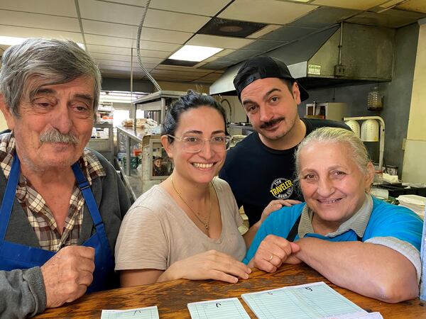 From left to right: Nick Poulos, Evie Poulos, Ben Poulos and Eleni (Helen) Poulos in the kitchen at Nick's Food To Go. 
(Bob Townsend for the AJC)