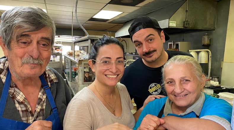 Nick Poulos (from left), Evie Poulos, Ben Poulos and Eleni Poulos are seen in the kitchen at Nick's Food to Go. Bob Townsend for The Atlanta Journal-Constitution