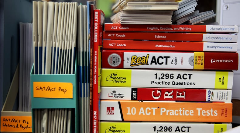 ACT and GRE prep books are stacked in a guidance counselor's office at Hobbton High School in Sampson County, N.C., May 19, 2017. (Travis Dove/The New York Times)
