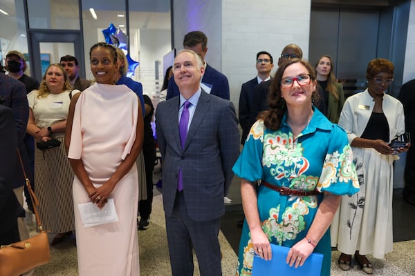 (From left) Georgia State University Law School Dean Courtney Anderson, president and CEO of Federal Home Loan Bank of Atlanta Reggie O’Shields, and director of the FHLBank Atlanta Heirs’ Property Law Clinic Sarah Stein appear at the ribbon-cutting event and reception of the new FHLBank Atlanta Heirs’ Property Law Clinic at Georgia State University Law School in Atlanta on Aug. 27, 2026. (Arvin Temkar/AJC)