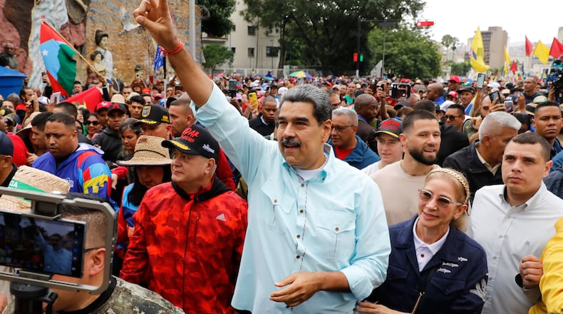 President Nicolas Maduro joins a rally marking the anniversary of the Battle of Santa Ines, which took place during Venezuela's 19th-century Federal War, in Caracas, Venezuela, Wednesday, Dec. 10, 2025. (AP Photo/Cristian Hernandez)