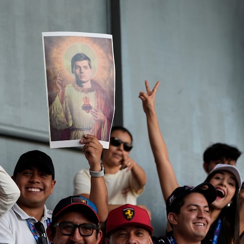 Fans of Max Verstappen of the Netherlands hold posters depicting him as the Scared of Jesus during a practice session of the Formula One Mexico Grand Prix auto race at the Hermanos Rodriguez race track in Mexico City, Friday, Oct. 24, 2025. (AP Photo/Fernando Llano)