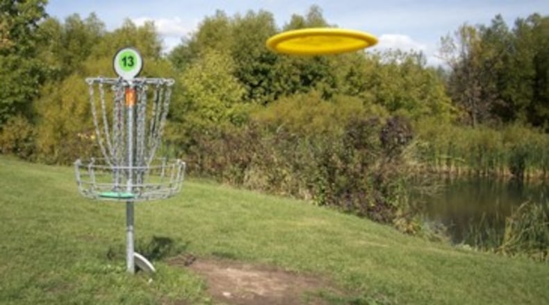 A new 18-hole disc golf course will open at 10 a.m. Nov. 12 at DeKalb Memorial Park, 381 Wilkerson Drive. AJC file photo
