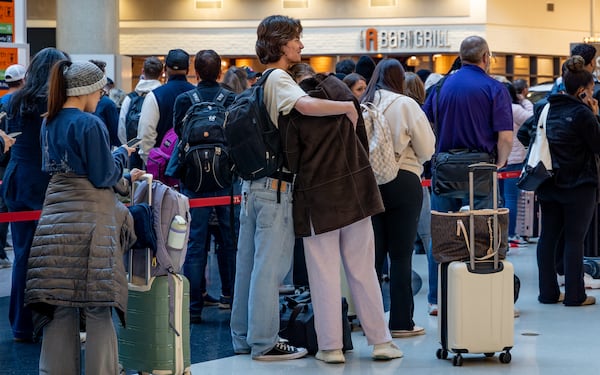 Early morning travelers wait in long lines at Hartsfield-Jackson Atlanta International Airport amid the ongoing partial goverment shutdown. (Ben Hendren for the AJC)