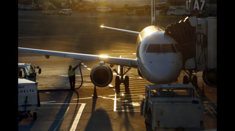 <p> FILE - In this Dec. 8, 2018, file photo, a worker fuels a Delta Connection regional airlines passenger jet at Logan International Airport in Boston. Delta Air Lines Inc. reports financial results Wednesday, April 10, 2019.(AP Photo/Bill Sikes, File) </p>