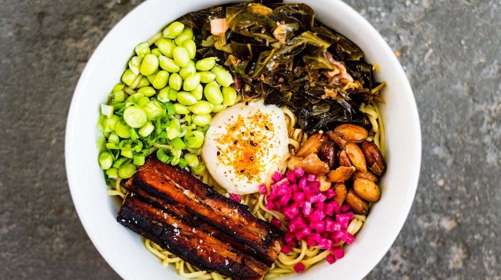 BoccaLupo cooks down collard greens, pork belly and barrel-aged soy for its ramen. CONTRIBUTED BY HENRI HOLLIS