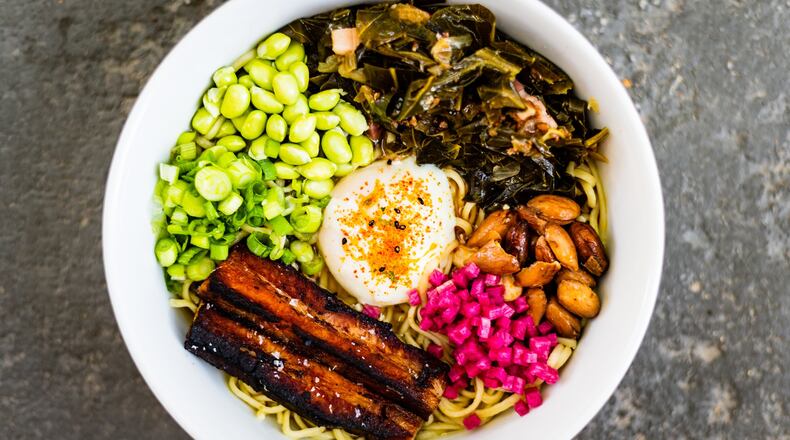 BoccaLupo cooks down collard greens, pork belly and barrel-aged soy for its ramen. CONTRIBUTED BY HENRI HOLLIS