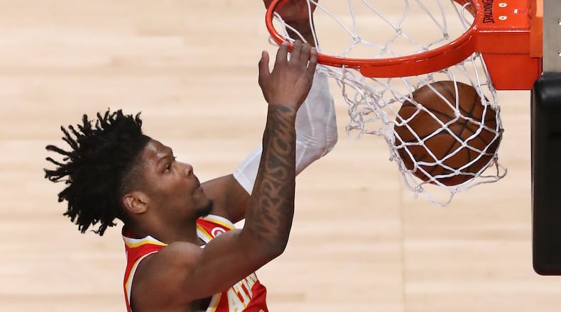 020421 Atlanta: Atlanta Hawks guard Cam Reddish slams for two against the Utah Jazz in an NBA basketball game on Thursday, Feb 4, 2021, in Atlanta. Curtis Compton / Curtis.Compton@ajc.com”