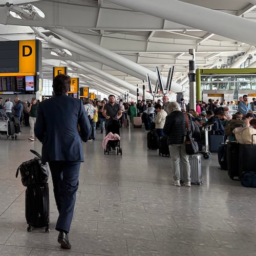 Passengers walk through Terminal 5 of London Heathrow Airport after flights were cancelled because of a technical issue in Britain's air traffic control system Tuesday, Sept. 8, 2026, in London. (Ellie Crabbe/PA via AP)