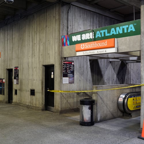 Crime scene tape stretches across an escalator at MARTA's Midtown station following a shooting Friday, June 5, 2026. (Ben Hendren for the AJC)