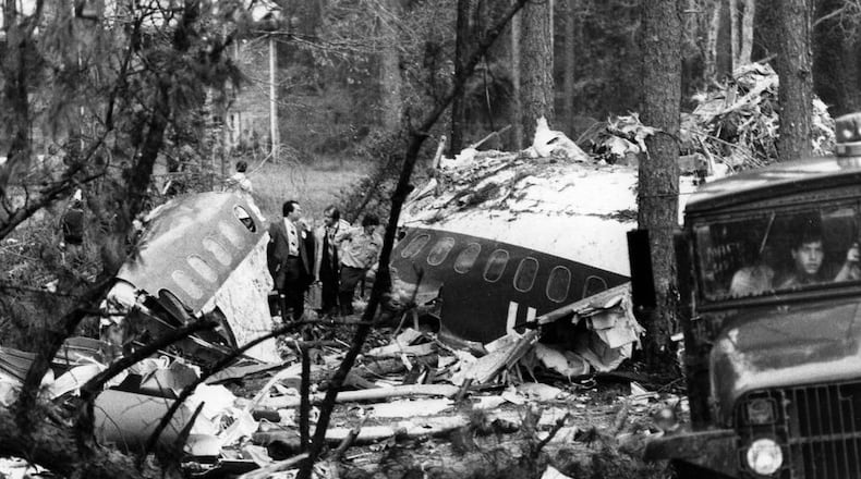 Investigators stand amid the ruins of Southern Flight 242 on April 10, 1977.